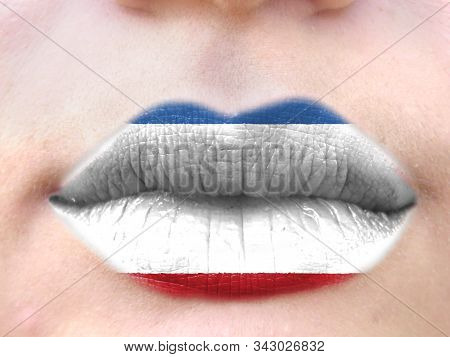 Female Lips Close Up With A Picture Flag Of Crimea. Learning Languages.