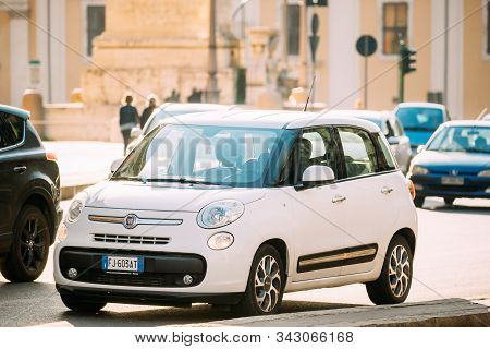 Rome, Italy - October 19, 2018: White Color Fiat 500l Moving At Rome Street. Five-door, Five Passeng