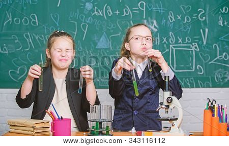 Girls Study Chemistry. Make Studying Chemistry Interesting. Microscope And Test Tubes On Table. Educ