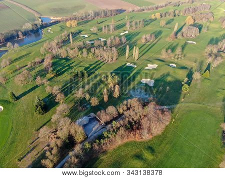 Aerial View Of A Golf Course. Colorful Trees And Green Course During Autumn Season In The South Of B