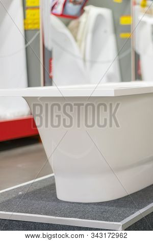 White Bathtubs In A Hardware Store. Vertical Photo