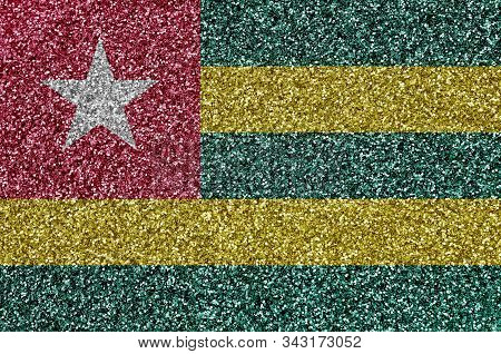 Togo Flag Depicted On Many Small Shiny Sequins. Colorful Festival Background For Party