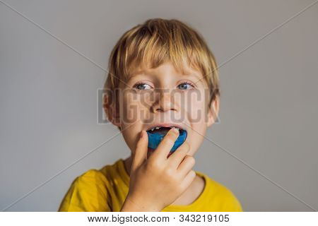 Six-year Old Boy Shows Myofunctional Trainer. Helps Equalize The Growing Teeth And Correct Bite, Dev