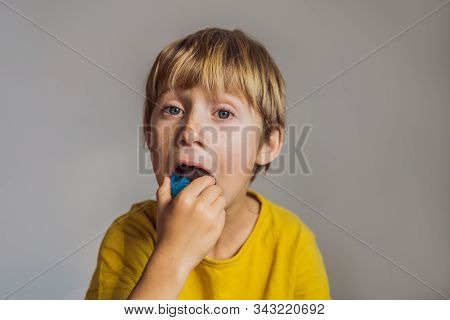 Six-year Old Boy Shows Myofunctional Trainer. Helps Equalize The Growing Teeth And Correct Bite, Dev