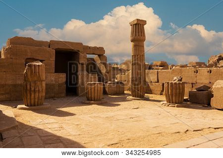 Foreground Of A Camel Dromedar Against The Backdrop Of The Great Pyramids, View Of The Sunset Sky In