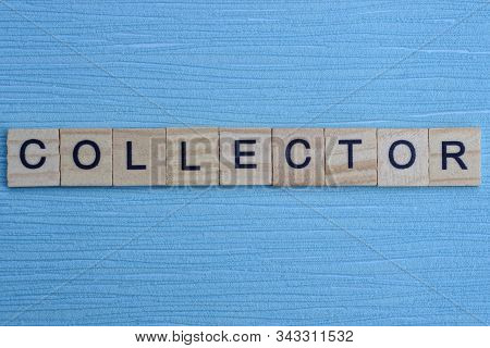 Gray Word Collector From Small Wooden Letters On A Blue Table