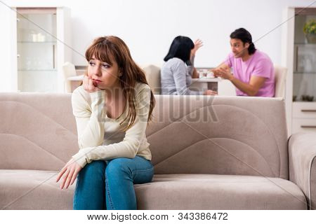 Young family and mother-in-law in family issues concept