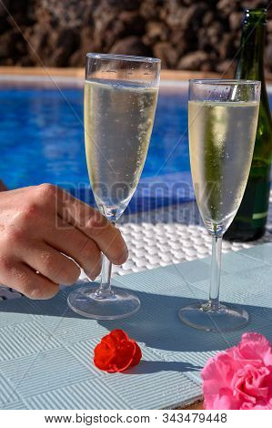 Pool Party With Two Glasses With  Bubbles White Champagne Or Cava Wine, Romantic Event Or All Inclus