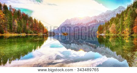 Faboulus Autumn Landscape Of Eibsee Lake In Front Of Zugspitze Summit Under Sunlight.
Location: Eibs