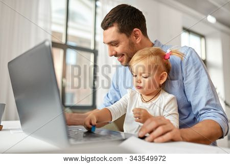 multi-tasking, freelance and fatherhood concept - working father with baby daughter and laptop computer at home office