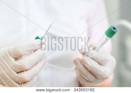 Doctor Holding Empty Plasmolifting Device With A Needle