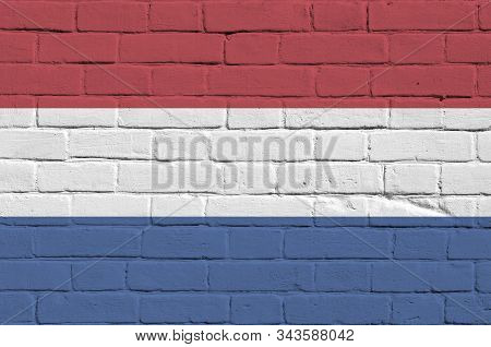 Netherlands Flag Depicted In Paint Colors On Old Brick Wall. Textured Banner On Big Brick Wall Mason