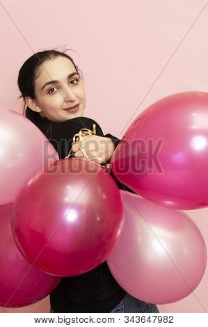 Young Pretty Woman In Casual Clothing Holding Festive Air Balloons. Portrait Of Happy 20s Middle-eas