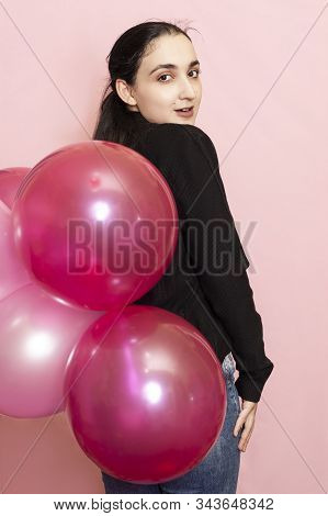 Young Pretty Woman In Casual Clothing Holding Festive Air Balloons. Portrait Of Happy 20s Middle-eas