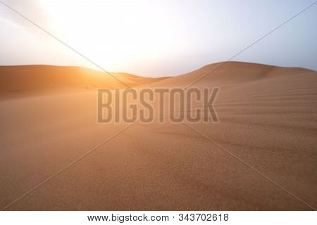 The Beauty Of The Sand Dunes In The Sahara Desert In Morocco. The Sahara Desert Is The Largest Hot D