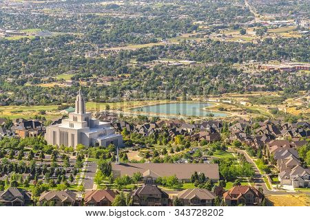 Temple And Geart Shaped Lake Amid Buildings And Houses In Salt Lake City Utah
