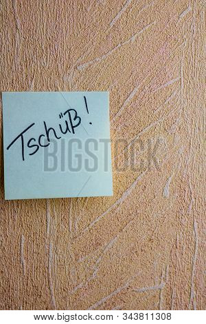 Text Tschuss (bye In English)on Post It. Writing On Colorful Sticky Note. Bucharest, Romania, 2020.