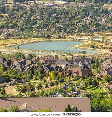 Square Temple And Geart Shaped Lake Amid Buildings And Houses In Salt Lake City Utah