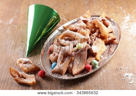 traditional french bugne, donut for carnival with confetti