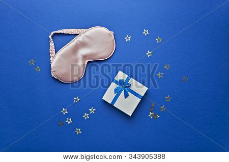 Sleeping Mask Ang Gift Box On Blue Background, Flat Lay. Valnetine Day Celebration Concept.