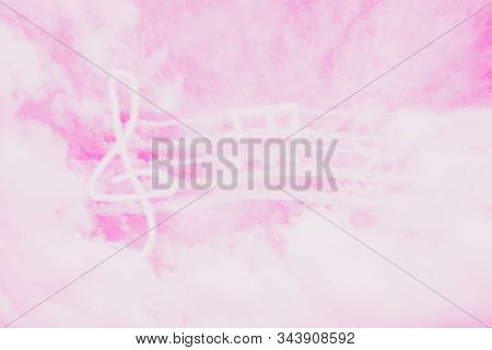 Music In Heaven. Music Violin Clef Sign Or G-clef Or Treble Clef And Notes In The Pink Sky. Abstract