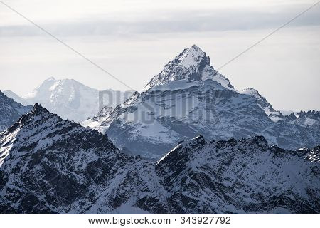 Majestic Mountain Peak Covered In Snow. Caucasian Ridge