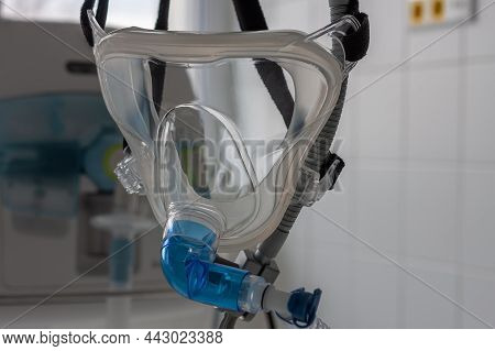 Non-invasive Ventilation Face Mask, Close Up View, On Background Medical Ventilator In Icu In Hospit