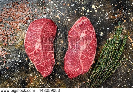 Raw Shoulder Top Blade Cuts, Beef Meat Steaks. Brown Background. Top View