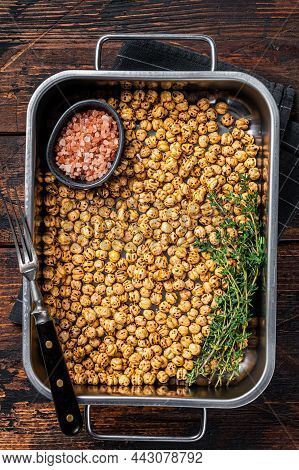 Vegetarin Snack Fried Chickpeas In A Kitchen Tray. Wooden Background. Top View