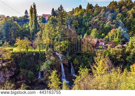 The small Croatian town of Slunj. Numerous picturesque waterfalls of the Korana River and the Sluncica River flowing through the city. The concept of ecological, active and photo tourism