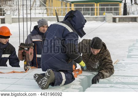 Installers Unloading Ice Blocks For An Ice Town