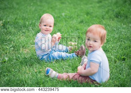 Toddler Eggs Hunters Close-up. Children Activity For Easter In Nature.