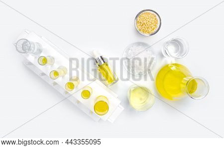 Cosmetic Chemicals Ingredient On White Laboratory Table. Candelilla Wax, Microcrystalline Wax, Yello