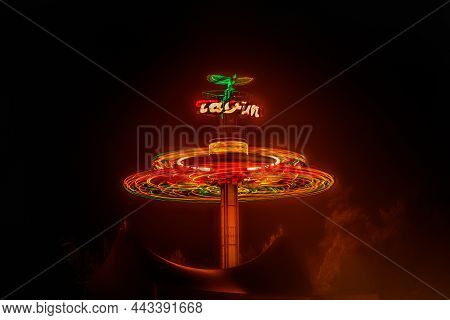 Kouvola, Finland - 28 August 2021: Rotating Ride Taifun In Amusement Park Tykkimaki At Night
