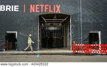 Bucharest, Romania - December 16, 2021: A Large Banner Advertising The Witcher On Netflix Covers A M