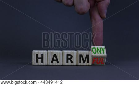 From Harmful To Harmony. Businessman Turns The Wooden Cube And Changes Word Harmful To Harmony. Beau