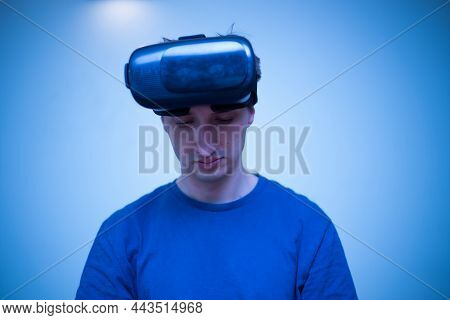 An Excited Young Guy In Virtual Reality Glasses Is Immersed In The Metaverse