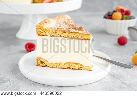 Traditional Polish Cake Karpatka On A Gray Concrete Background. Cake Of Choux Pastry Dough And Custa