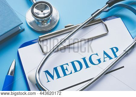 Medicare Supplement Insurance Medigap Application And Stethoscope.