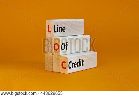 Loc, Line Of Credit Symbol. Wooden Blocks With Words 'loc, Line Of Credit'. Beautiful Orange Backgro
