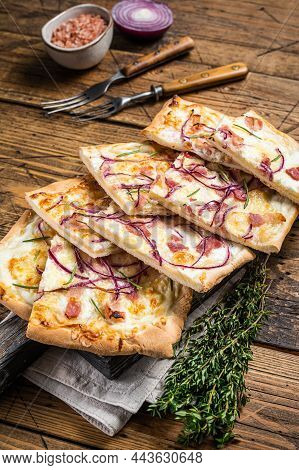 Flammkuchen Or Tarte Flambee With Cream Cheese, Bacon And Onions. Wooden Background. Top View