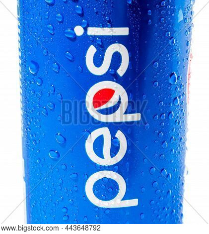 On A White Background, A Blue Can Or Glass With Drops Of Water And An Inscription Pepsi. Close-up. A