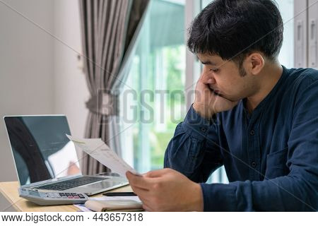 Men Stress About A Lot Of Credit Card Debt And Bills On The Floor. The Housewife Has Trouble Calcula