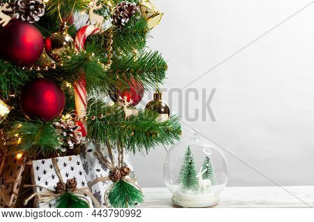 Part Of Christmas Tree With Toys And Wooden Garland On White Background. Celebration Of New Year. Se
