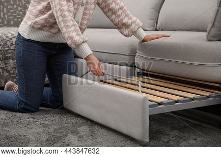 Woman Making Sleeping Place For Guest In Living Room, Closeup. Convertible Sofa
