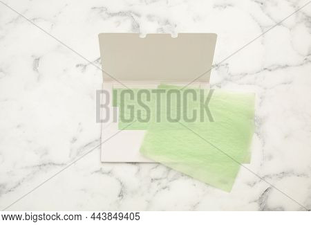 Facial Oil Blotting Tissues On White Marble Table, Flat Lay. Mattifying Wipes