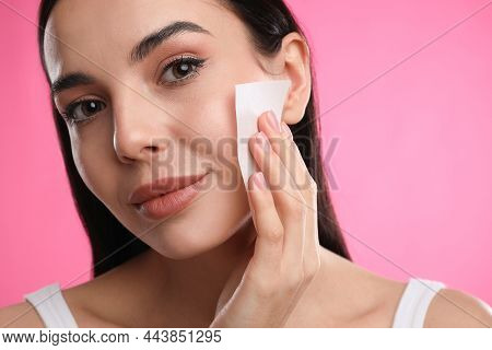 Beautiful Woman Using Mattifying Wipe On Pink Background, Closeup
