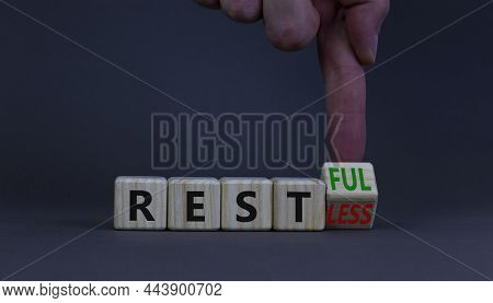 Restless Or Restful Symbol. Doctor Turns The Wooden Cube, Changes The Word Restless To Restful. Beau