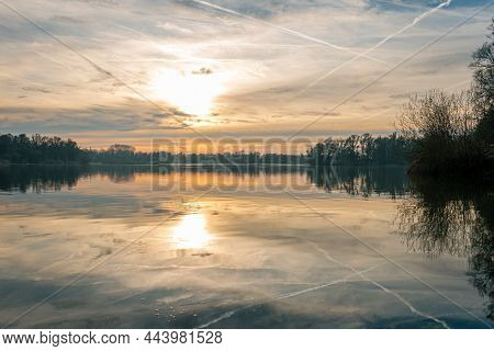 Beautiful Sunset With Orange And Yellow Gold Colors In Winter Time At The Floodplains Of The Rain Ri