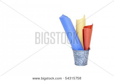 Galvanised Bucket Containing Three Rolled Colored Papers